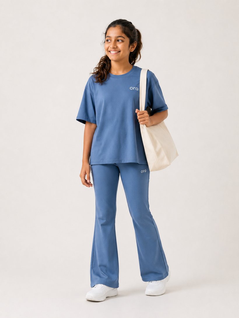 Tween in Ora oversized boxy tee and flared leggings